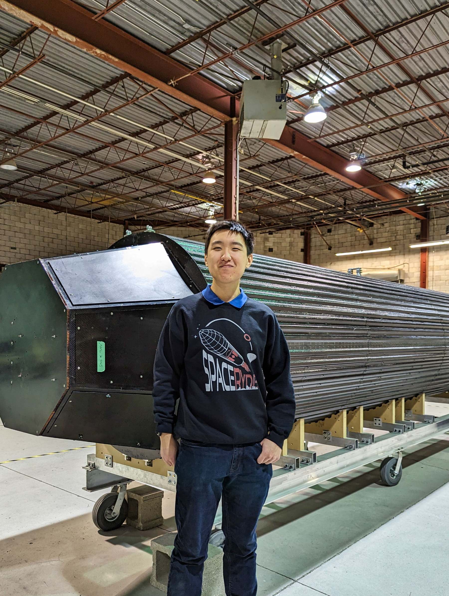 Standing next to SpaceRyde's orbital rocket